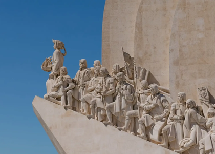 Close-up of the Monument to the Discoveries (Padrão dos Descobrimentos) in Belém, Lisbon, featuring historical Portuguese explorers and figures.