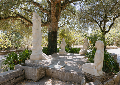 Stone sculptures of the three kneeling shepherd children before the Angel of Portugal at Loca do Cabeço, Fátima