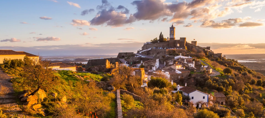 Panoramic view of Monsaraz village and castle at sunset, in the Alentejo region of Portugal.