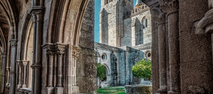 Gothic cloister of Évora Cathedral with view of the bell tower and central garden
