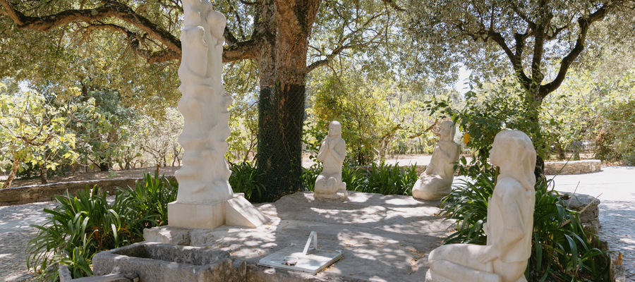 Stone sculptures of the three kneeling shepherd children before the Angel of Portugal at Loca do Cabeço, Fátima