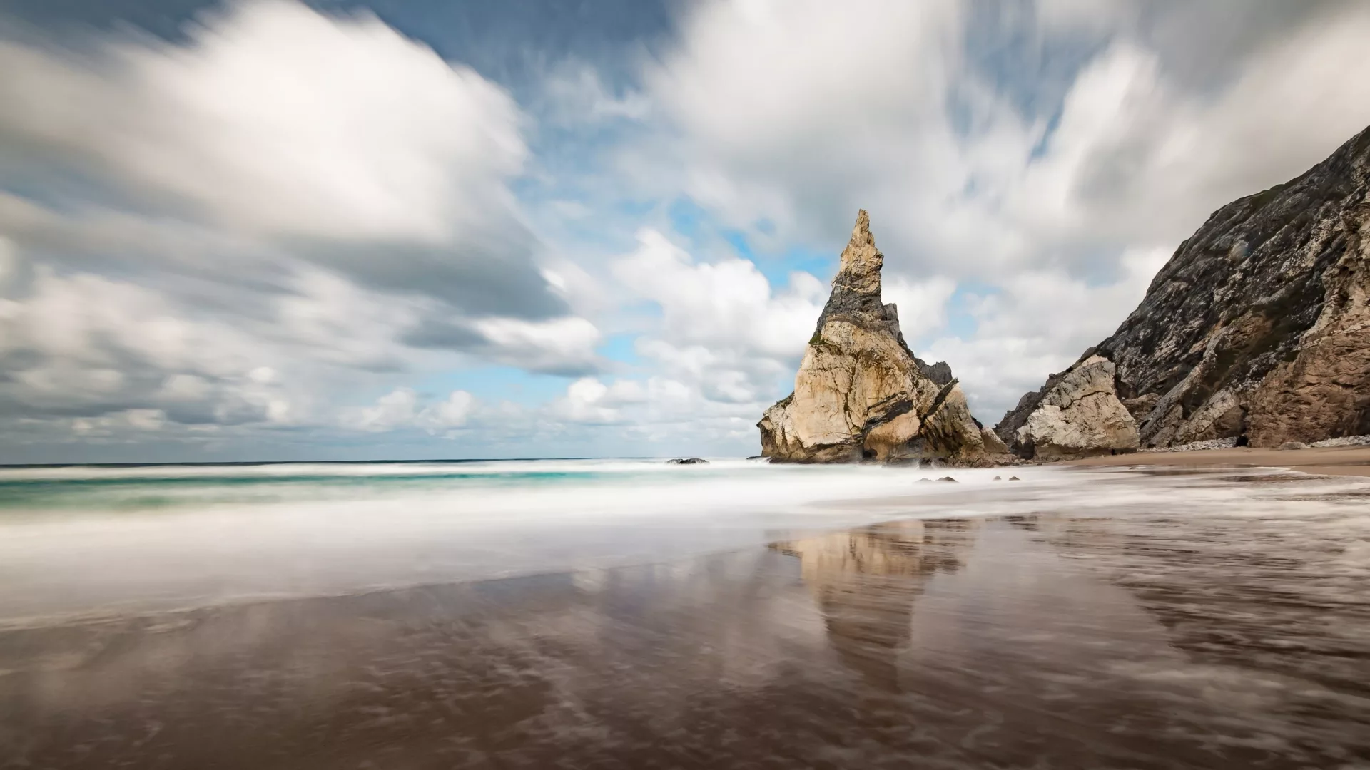 Praia da Ursa, a stunning wild beach near Cabo da Roca in Sintra, Portugal, with dramatic cliffs, rock formations, and Atlantic waves.