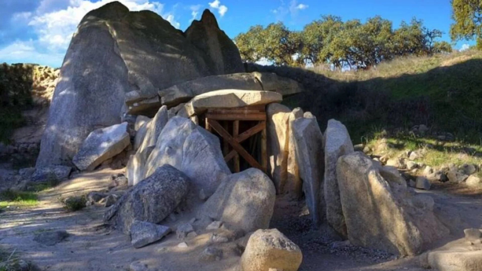 View of the Anta Grande do Zambujeiro, a megalithic dolmen near Évora, Portugal, with large granite stones forming the prehistoric tomb.