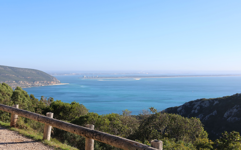 Scenic view from the Arrábida Mountains overlooking the Sado Estuary and the Tróia Peninsula on a clear day.