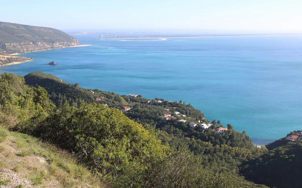 Panoramic view from Arrábida mountain range overlooking the Atlantic Ocean and the Tróia peninsula.