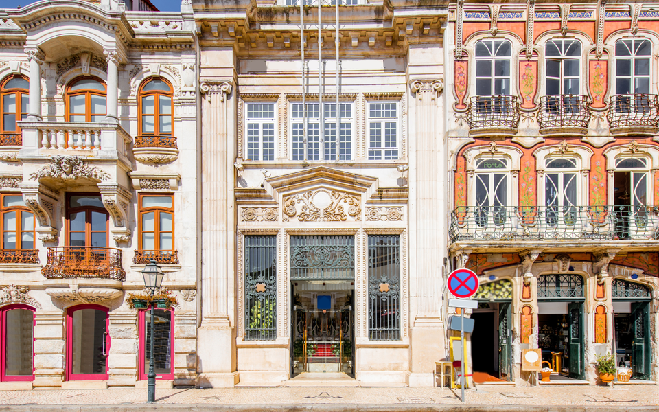 Art Nouveau buildings in Aveiro’s historic center with decorative windows and balconies.