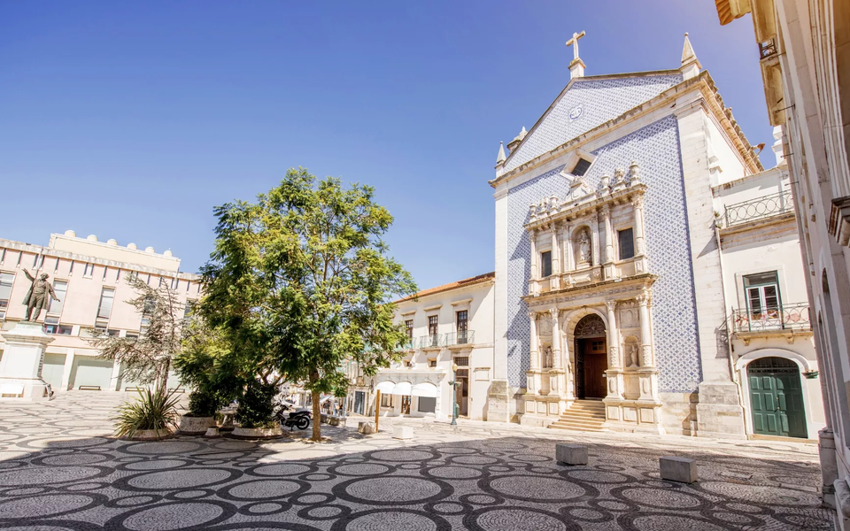 Church of Misericórdia in Faro, Portugal, with traditional Portuguese pavement and tiled façade.