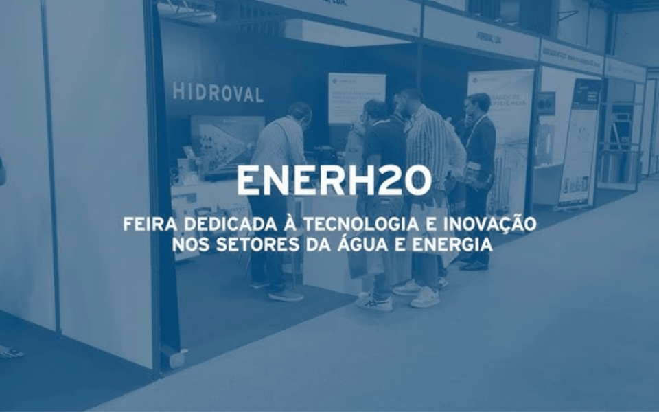 Exhibition booth at ENERH2O 2025, a trade show focused on technology and innovation in the water and energy sectors. Attendees engage with exhibitors at the Hidroval stand. The event promotes sustainable solutions and industry advancements.