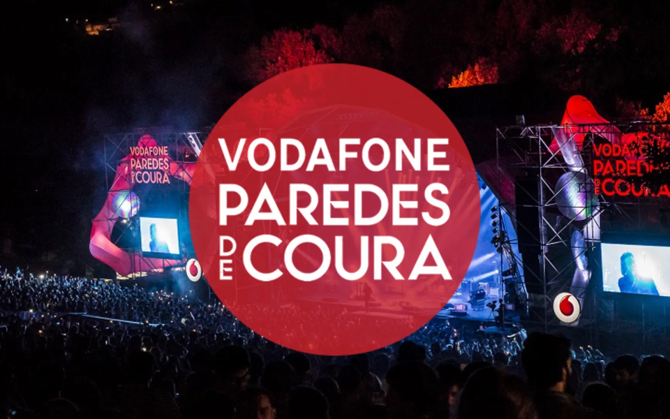 Vodafone Paredes de Coura music festival main stage at night with crowd and red branding in Portugal.