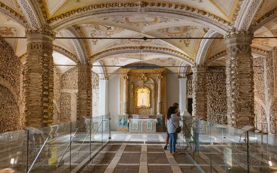 The Chapel of Bones in Évora is adorned with human bones, creating a striking and contemplative interior space.